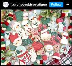 some cookies are laying on top of each other and decorated with christmas themed decorations, such as snowmen