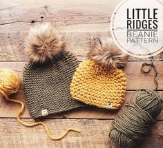 two knitted hats and yarn on a wooden surface