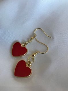 "FIRST TIME DISCOUNT: USE CODE FIRSTTIME20 FOR 20% YOUR FIRST ORDER! ♡ ALL PACKAGING IS 100% RECYCLABLE, BIODEGRADABLE, OR MADE FROM 100% RECYCLABLE MATERIALS ♡ These super cute gold heart dangling earrings are a perfect accessory to your already gorgeous ears! ALL ORDERS NOW COME WITH A GIFT BOX! Listing comes with two earrings (aka: one pair)! Dimensions: heart: 17mm entire earring: around 1.5\" (one and a half inches) long Materials: hook: 14kt Gold Plated 14kt Gold Filled ALL PACKAGING IS 10 Gold Heart Jewelry, Gold Heart Earrings, Red Heart Earrings, Gold Heart Earring, Recyclable Materials, Red Jewelry, Classy Jewelry, Jewelry Lookbook, Earrings Red