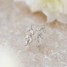 Intricate and chic, these nature-inspired ear climbers feature a beautiful leaf design crafted in lavish pavé crystals. Fasten with a wire at the rear of the lobe to comfortably hold them in place. Available in: 925 Sterling Silver / Gold Vermeil Marquise Cubic Zirconia crystals Hypoallergenic Back Hook Includes rubber backs (optional to use) Length: 0.75in (1.9cm) x Width: 0.3in (8mm) #E247 Ear Climbers, Leaf Design, Nature Inspired, Gold Vermeil, Design Crafts, Nature Inspiration, Silver Gold, Cubic Zirconia, Silver Rings