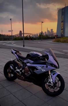 a motorcycle parked in front of a city skyline