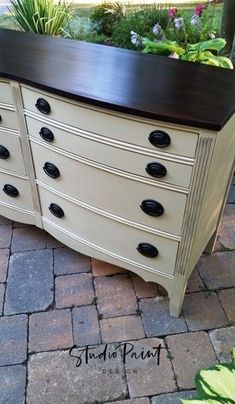 an old dresser is turned into a planter