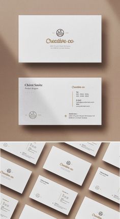 some white business cards with gold foil on them and the words creative co written in black ink