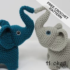 two crocheted elephants are standing next to each other, one is blue and the other is gray