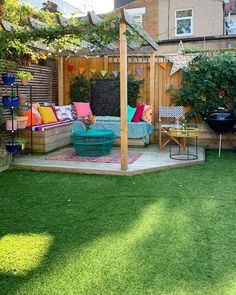 an outdoor living area with grass and furniture