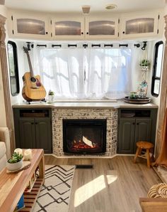 a living room filled with furniture and a fire place