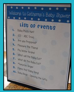 a baby shower sign with blue polka dots and the words list of events on it