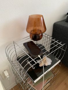 a lamp sitting on top of a metal rack