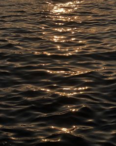 the sun shines brightly on the water as it reflects off the surface of the ocean