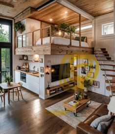 a living room with a loft bed and stairs