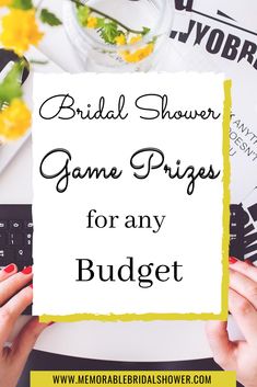 the words bridal shower game prizes for any budget on top of a table with flowers