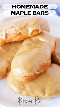 three glazed donuts on a white plate