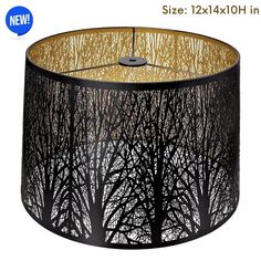 a black lamp shade with trees on it