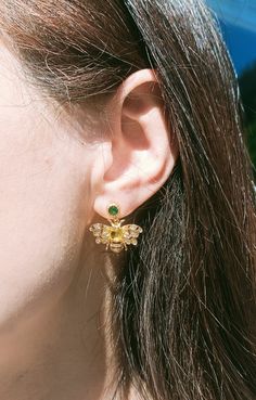 14K gold plated Bee Stud Earrings, Honey Bee earrings, Bumble bee earrings with Yellow and Green CZ Gemstones, Bee Jewelry, Gift for her  ** Material: CZ, 14K gold plated ** Dimension:     Length: 20mm     width：20mm ** 1 Pair **Note Materials such as oil, nail polish, nail polish remover, chlorine, and perfume can potentially trigger a chemical reaction with metal or plated jewelry, leading to tarnishing. The same applies to sweat, so it's important to take off your gold-plated jewelry while en Bumble Bee Earrings, Honey Bee Earrings, Bee Studs, Chemical Reaction, Bee Jewelry, Bee Earrings, Yellow And Green, Honey Bee, Gold Plated Jewelry