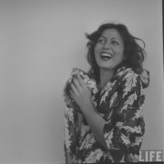 black and white photograph of a woman laughing