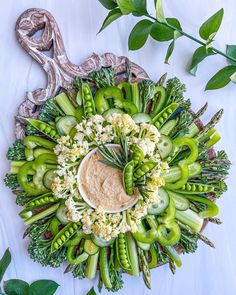 an arrangement of broccoli, cauliflower and other vegetables arranged in a circle