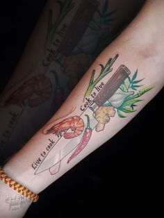 a person with a tattoo on their arm holding a knife and some food in it