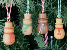 "These beautiful wooden Christmas tree Snowmen decorations are the perfect way to brighten up your family's Xmas tree and will last for years to come! ☃️ Made from a variety of hardwoods (they measure approximately 50mm high (2\" they are all individually hand crafted which makes them unique! After being turned, I polish each one with wax then decorate with a scarf and contrasting hanging loop. This makes them ready to go straight onto your Christmas tree or anywhere else they can hang from! The Turned Christmas Ornaments, Snowmen Decorations, Christmas Diy Wood, Snowmen Ornaments, Wood Christmas Tree, Xmas Tree Decorations, Snowman Decorations