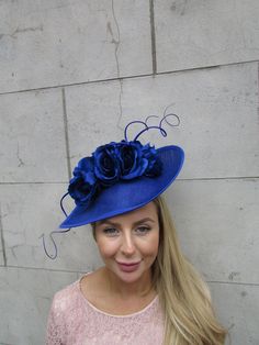 This hat is perfect for special occasions. Featuring royal blue artificial flowers and striking statement feathera on a royal blue base. Mounted on a thin royal blue headband. The base measures 30cm across at it's widest point. Perfect for races, weddings and special occasions! Made in the UK -   .   Many more items like this are available in our shop! Made in the UK - custom orders are welcome Blue Artificial Flowers, Blue Rose Flower, Special Occasion Hats, Baby Blue Weddings, Blue Headband, Flower Fascinator, Feather Wedding, Wedding Fascinators, Fascinator Hat