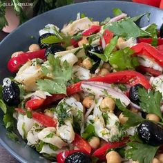 a blue bowl filled with lots of food