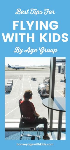 a boy sitting in a chair looking out the window at an airport with text overlay that reads best tips for flying with kids by age group