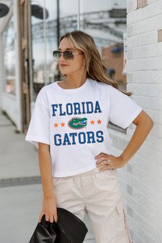 Whether you're cheering on your team from the sidelines or enjoying the festivities at the tailgate, our Spring Collection Game Day Essentials are sure to keep you looking and feeling fabulous all season long. Join the fashion game and make every game day unforgettable! From The Sidelines, Florida Gators, Women Crop, Crop Tee, Spring Collection, Game Day, Fashion Games, The Fashion, Florida