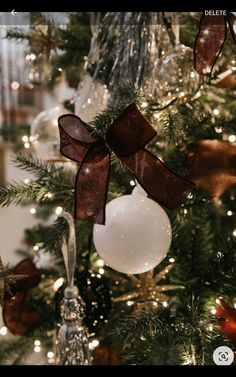 a christmas tree with ornaments and lights on it