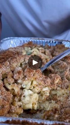 a close up of a pie in a pan with a spoon sticking out of it