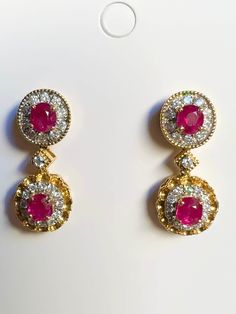 SOLD OUT - Four pieces Burmese natural unheated ruby and natural diamond earrings in 18K solid gold PRICE: $0, VALUATION: $11,840 by NCJV Registered Valuer Reg: N683 The pair of earrings contain two (2) oval shape four claw set ruby surrounded by single halo contain twenty-four (24) round brilliant cut micro claw set diamonds attached to a cluster design containing two (2) oval shape four claw set ruby surrounded by twenty-two (22) round brilliant cut micro claw set with millegrain detail. Earrings are secured with post and butterfly closure. 𝐅𝐞𝐚𝐭𝐮𝐫𝐞𝐬 : + Main Gemstone - Burmese Unheated Natural Ruby + Total Carat Weight of Ruby (2pc) - 1.90CT (approx) + Color -Red + Clarity - Lightly Included as Natural Unheated Gems + Origin - Mogok (Burma, Myanmar) + Additional Supporting Gemsto Ruby Brooch Jewellery, Ruby Gemstone Diamond Earrings For Formal Occasions, Formal Ruby Gemstone Diamond Earrings, Luxury Diamond Earrings With Prong Setting, Classic Ruby Diamond Earrings With Accents, Classic Ruby Diamond Earrings With Diamond Accents, Ruby Diamond Earrings With Brilliant Cut, Ruby Brilliant Cut Fine Jewelry Earrings, Fine Jewelry Ruby Diamond Earrings