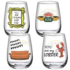 four wine glasses with different designs and phrases on them, all in clear glassware