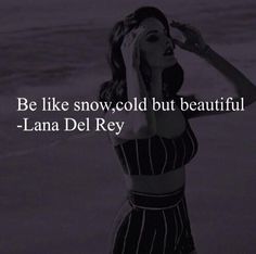 a woman is standing in the water with her hand on her head and she has a quote above her that says, be like snow, cold but beautiful - lana del ray