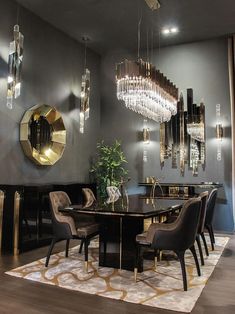 an elegant dining room with chandelier and table in the center, surrounded by black chairs