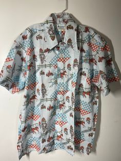 "Truly looks and feels like its unworn, was folded neatly and pinned to cardboard / still has a bit of crispiness to it - labeled sz XL measures pit to pit 25\"/ waist 24 1/2\"/ length (shoulder to bottom) 29\" / smoke free environment (83P)" Retro Collared Tops For Rodeo, Vintage Cotton Shirt With Retro Print, Retro Short Sleeve Shirt With Button Closure, Vintage Collared Tops For Rodeo, Vintage Short Sleeve Shirt For Rodeo, Vintage Cotton Shirt For Rodeo, Vintage Collared Shirt For Rodeo, Retro Button-up Shirt With Button Closure, 1970s Style Fitted Button-up Shirt