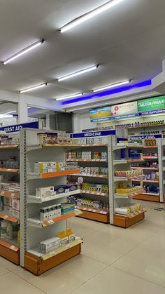 an empty pharmacy store filled with lots of shelves