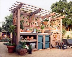 an outdoor kitchen with potted plants and gardening equipment