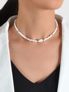 White Beaded Choker Necklace White beads with Gold accents Choker. Small conch shell finishes the look. Very Pretty! Measures 14* with 3" extension Necklace White, Conch Shell, Necklace Fashion, Beaded Choker Necklace, Beaded Choker, White Beads, Conch, High Quality Jewelry, Gold Accents