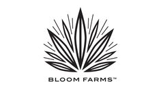 the bloom farms logo is shown in black and white, with sunbursts coming out