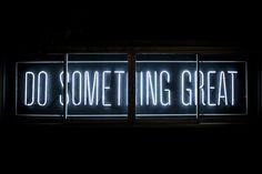 a neon sign that says do something great