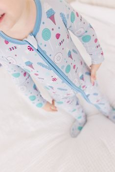 Kickee Pants Footie PJs - The Softest Footed Pajamas for Babies and Toddlers These cutesy footie pajamas for babies come with a zipper to keep tiny toes snug and secure. The feet and flip paws are lined with a cuddly fleece and the bottom is embroidered with anti-slip polka-dots, so your toddler can outpace you all day, accident-free. About Me: So soft you'll want a pair of your own Machine wash cold, lay flat...ahhh adulting! Hypoallergenic for sensitive skin Fabric Content: 95% Viscose from Ba Playful White Footie For Playtime, Playful Fitted Onesie For Sleepovers, Playful Fitted Footie For Bedtime, Footie Pajamas, Footed Pajamas, Boys Sleepwear, Footie Pajama, Kickee Pants, Make Believe