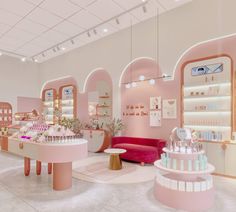 the interior of a store with pink walls and furniture