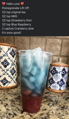 a cup filled with ice sitting on top of a counter