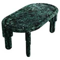 a green marble table with legs