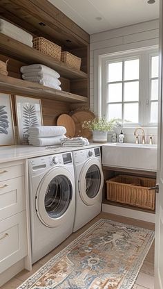 a washer and dryer in a bathroom with wooden shelves on the wall above