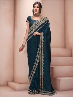 Teal and gold-toned sareeEthnic motifs embroidered saree with embroidered border borderHas embroidered detailThe saree comes with an unstitched blouse pieceThe blouse worn by the model might be for modelling purpose only. Check the image of the blouse piece to understand how the actual blouse piece looks like. Semi-stitched Sharara With Embroidered Border For Reception, Saree With Zari Weaving For Reception And Transitional Seasons, Designer Gold Sharara With Embroidered Border, Anarkali Pre-draped Saree With Embroidered Border For Reception, Anarkali Pre-draped Saree For Reception With Embroidered Border, Eid Reception Zari Weaving Pre-draped Saree, Embroidered Reception Pre-draped Saree, Anarkali Traditional Wear With Embroidered Border For Reception, Traditional Drape Sharara With Embroidered Border For Reception