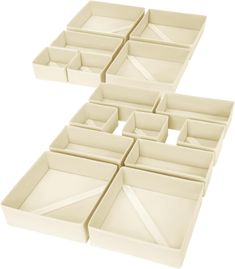 four white trays with different shapes and sizes