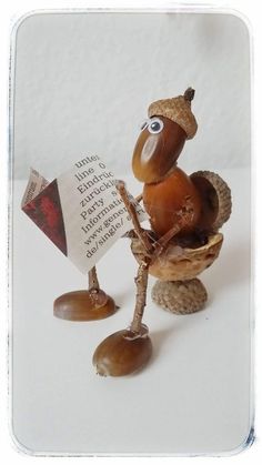 a figurine of a snail holding a book