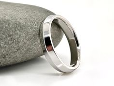 All orders placed before December 8th will deliver in time for Christmas if you live in the USA, AND get PRIORITY MAIL at check out, production times listed on ads are currently correct. Shimmering Sterling Silver Band, 4x2mm Modern Band, Knife Edge.    Free Inside Ring Engraving. These Rings are Minimal & Simple - Heirloom Quality Silver Bands.  Solid sterling silver. - Beautiful solid silver rings.  - Shiny finish or brushed finish (request in personalization box) - Made to order, just for you. Each ring is made with high-quality American smelted .925 Sterling Silver, 100% nickel free; these rings are not plated or hollow.  These are also milled out of a solid piece of metal, so no solder joins. I make this ring in other metals: Yellow Gold:    White Gold:   Rose Gold:     I offer engage Ring Engraving, 22k Gold Ring, Modern Wedding Band, Unique Wedding Ring, Silver Bands, Measure Ring Size, Triangle Ring, Wedding Rings Unique, Size 10 Rings