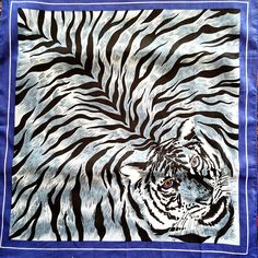 This is a beautiful bandana with a very striking tiger print design. The bandana is all cotton. It is royal blue with a grey and black animal pattern. The scarf can be used by men and women as a neck wrap, bandana, headband, hair tie, bag decor, etc. The scarf is in excellent/mint condition and will also make a beautiful gift. It comes in a gift wrap and with a 'Thank you' card. For more scarves in my store, please, visit: https://www.etsy.com/ca/shop/NostalgicByLiliya?ref=seller-platform-mcnav& Wrap Headband, Scarf Bandana, Bandana Headband, Black Animals, Women Gifts, Headband Hair, Neck Wrap, Tiger Print, Decor Accessories