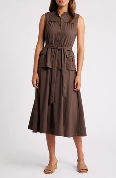 Cargo pockets lend utilitarian flair to a sleeveless midi dress cast in a delightfully earthy hue. 46" length (size Medium) Front button closure Band collar Sleeveless Side cargo flap-patch pockets Removable tie belt Unlined 65% polyester, 35% nylon Dry clean Imported Olive Sleeveless Midi Dress, Chic Sleeveless Khaki Midi Dress, Elegant Sleeveless Midi Dress With Pockets, Casual Sleeveless Belted Midi Dress, Chic Midi Dress With Slip Pockets For Work, Khaki Sleeveless Dress With Pockets, Brown Spring Midi Dress With Pockets, Khaki Sleeveless Dress For Work, Spring Utility Dress For Workwear