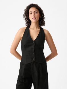 Soft linen-cotton vest.  Halter neckline.  Sleeveless.  Button front.  Welt pockets at front.  Smocked back.  * Fit: Slightly fitted.  Sits close to the body.  Hits at the hip.  Models wearing Gap Halter Vest, Keeping Up Appearances, Cotton Vest, Wedding Officiant, Black Vest, Halter Neckline, Soft Hand, Costume Ideas, Welt Pockets